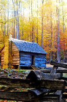 Log Cabin nestled in fall foliage
